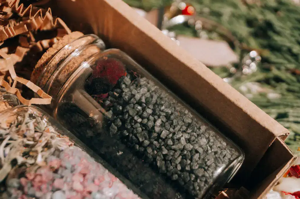 Three spice jars arranged in a dark elegant gift box