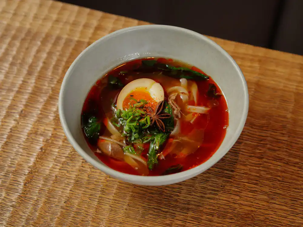 A warm bowl of golden spiced broth