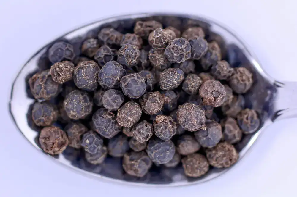 Close up texture of rich black peppercorns